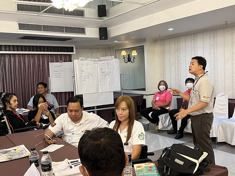 Mr. Watcharapol Chuengcharoen, Chief, Networking & Collaboration, APCD facilitators demonstrating a social model exercise to improve the quality of services and accessibility for persons with disabilities during session.