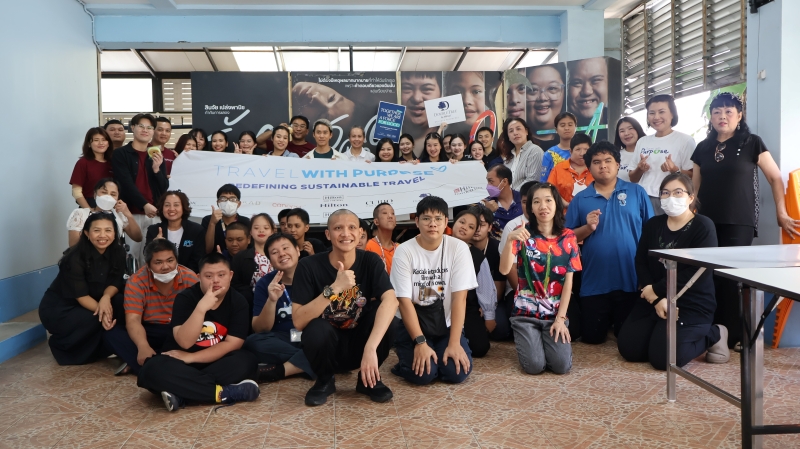 Representatives from three hotels and persons with intellectual disabilities pose for a photo together.