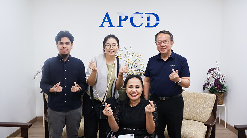 Picture 1: A group photo including (from left) Mr. Thapanut Nookuea, Ms. Jiyoung Kim, Ms. Nongnuch Maytarjittipun (seated in a wheelchair), and Mr. Piroon Laismit, Executive Director of APCD.