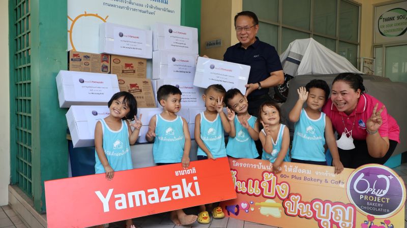 Picture 2: Mr. Piroon Laismit, Executive Director of APCD, for a group with a staff member and the children