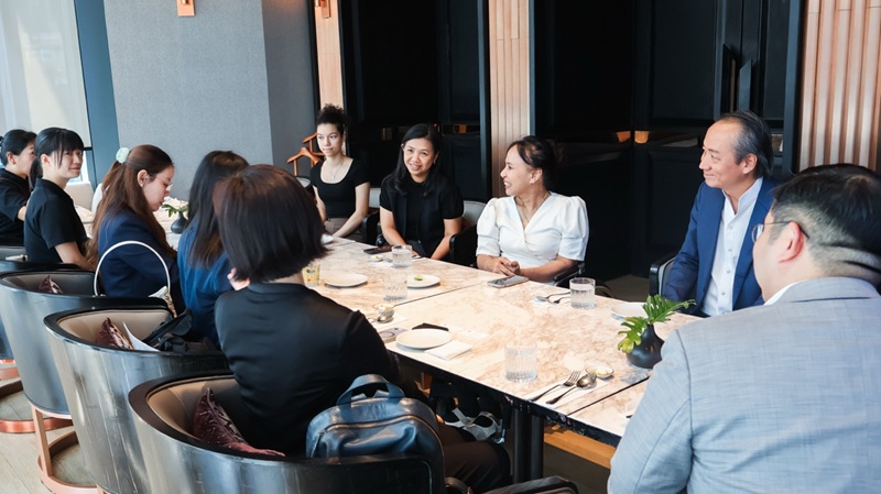 Picture 3: APCD representatives (facing the camera) and Mr. Sammy Carolus (right, facing the camera) speak with the JICA Thailand delegation (opposite them) and Mr. Narinthon Jaiyen (right, opposite them)