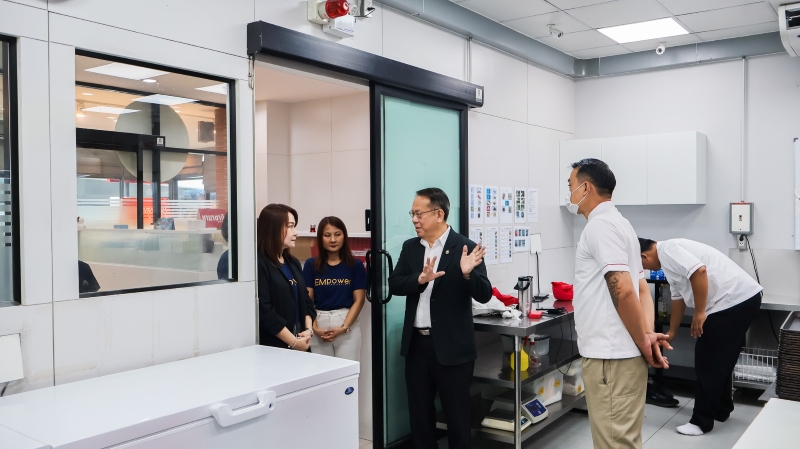 Picture 6: Mr. Piroon Laismit, Executive Director of APCD, guides the delegation through the APCD 60+ Plus Projects