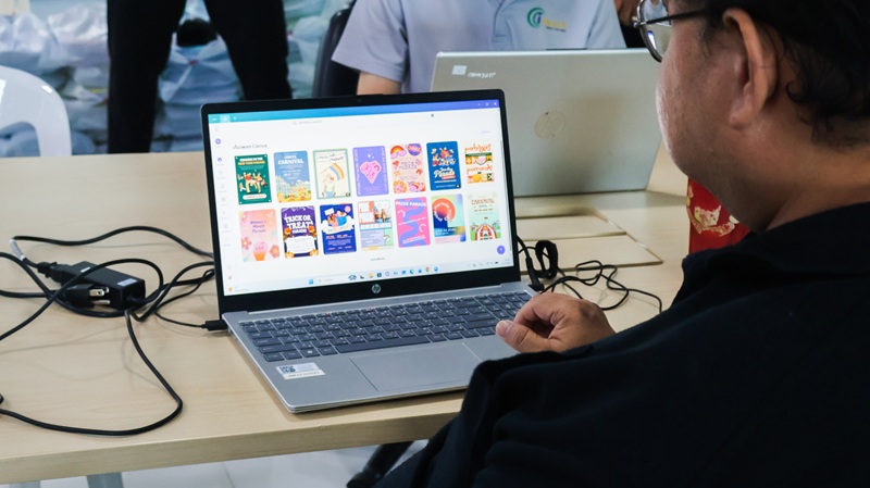 Picture 6: A staff member works on a computer