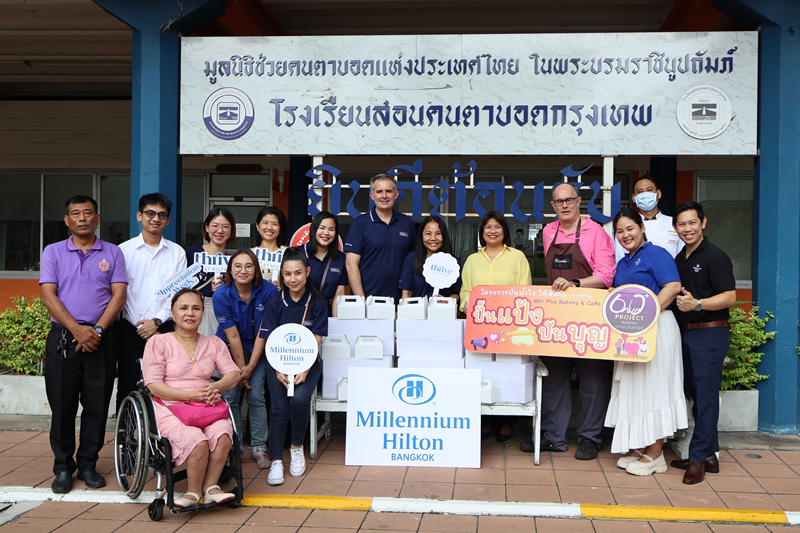 Bread donation to students at a School for the blind.