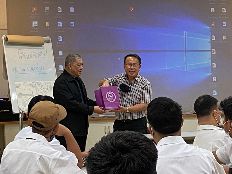 Mr. Piroon Laismit, APCD Executive Director, presented a token of appreciation (APCD Chocolate gift boxes made by people with disabilities) to H.E. Mr. Poldej Worachat.