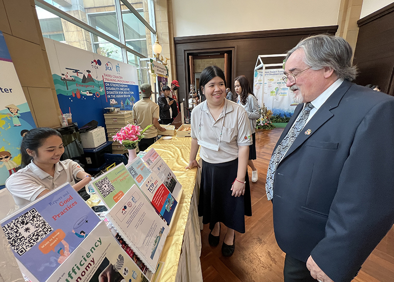 Community Development team welcoming visitors, sharing valuable information at the APCD disability inclusive development booth.