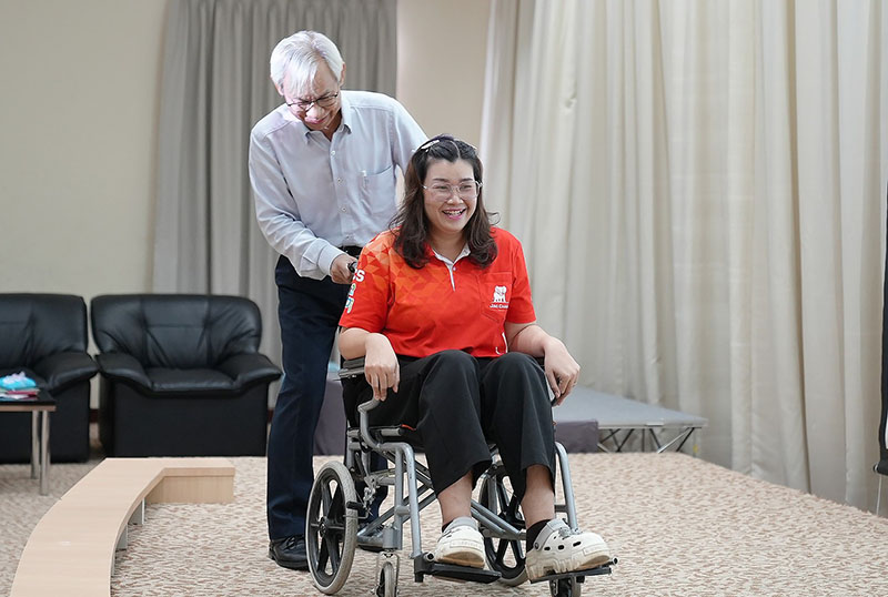 Workshop on how to assist wheelchair user.