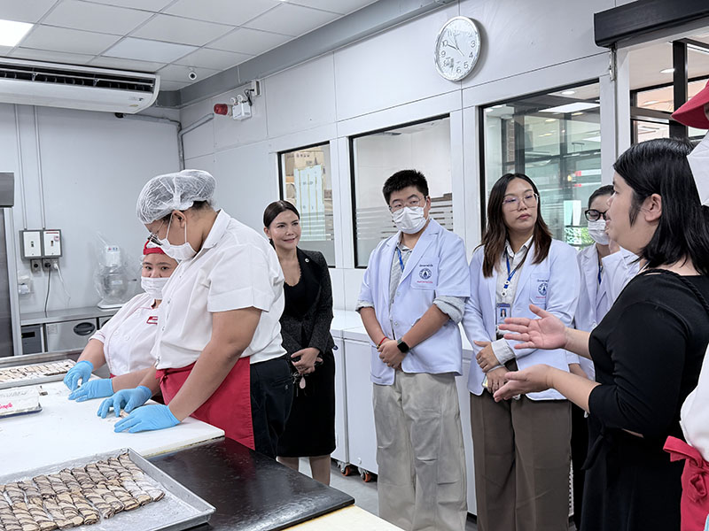 Student learned about inclusive employment at the APCD 60+ Bakery & Chocolate Café, facilitated by Ms. Supaanong Panyasirimongkol.