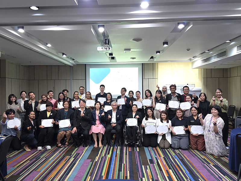 Final group photo featuring participants with their DET completion certificates together with DET facilitators and project working group members.