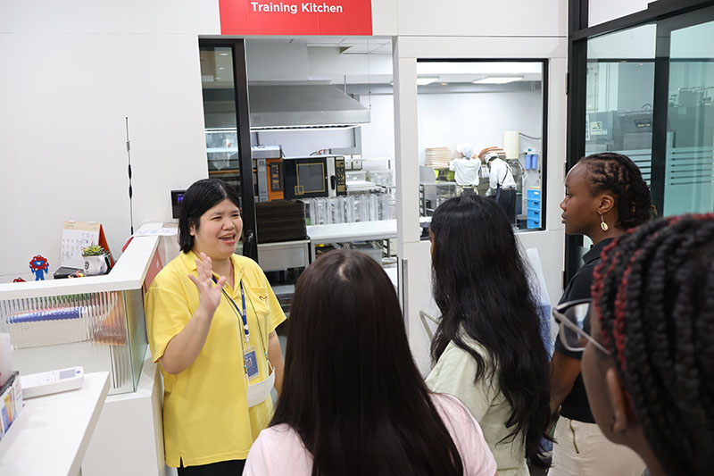 Led by Ms. Supaanong Panyasirimongkol, Networking and Collaboration Officer, the group visited the 60+ Plus Bakery & Café and observed the "Skills Development for Persons with Disabilities" program, including the APCD 60+ Plus Kitchen by CP.