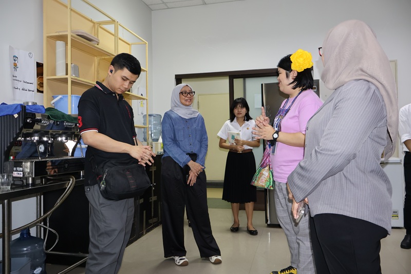 Three delegates from LSPR-SSNE touring the 60+Plus Bakery & Chocolate Cafe. From left to Right: Mr. Muhammad Abijdzar Alghivari, Office Administrator from the ASEAN Autism Network (AAN), Dr. Chrisdina M.Si., Dean of Faculty of Special Education, and Ms. Novita Sari, lecturer, Faculty of Special Education.