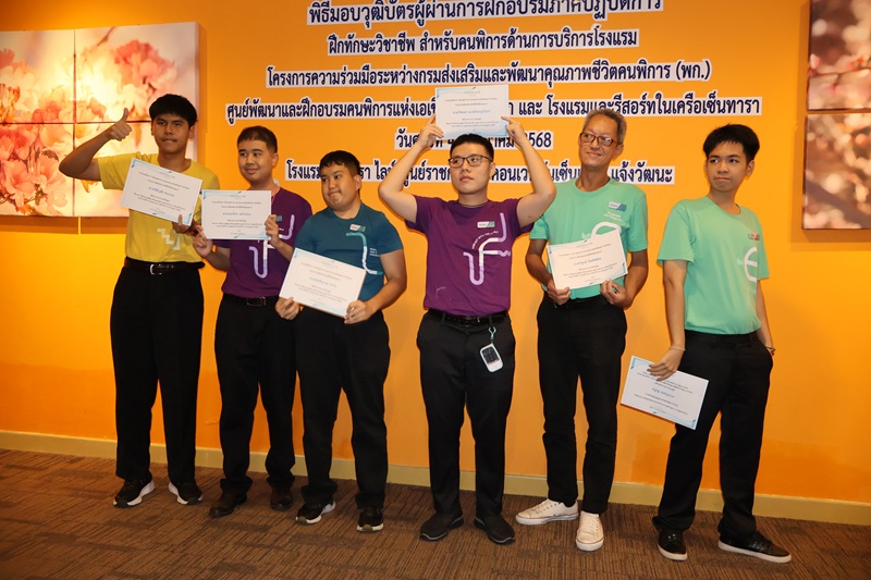 Interns mark the end of their hotel training with a group photo.