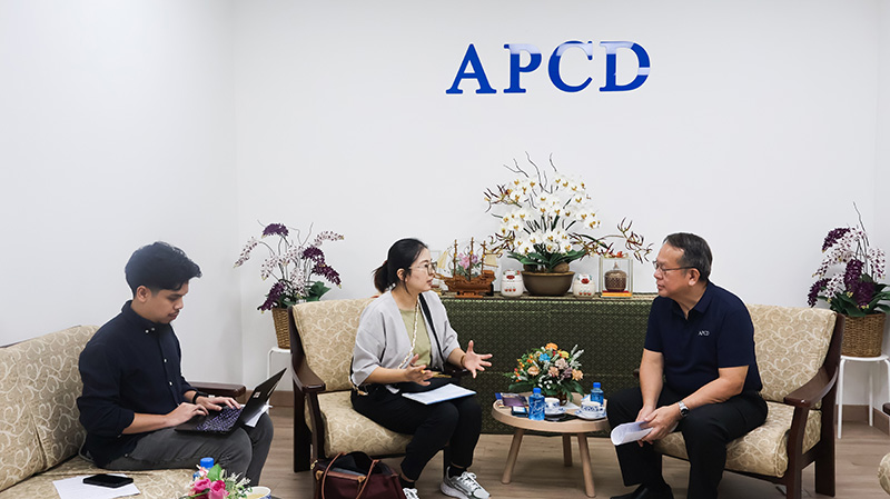 Picture 2: Ms. Jiyoung Kim (center) interviews Mr. Piroon Laismit, Executive Director of APCD (right), while Mr. Thapanut Nookuea (left) records the interview on a laptop.