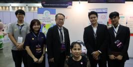 Mr. Piroon Laismit and participants pose for a photo at the APCD both.