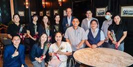 Picture 1: From left to right in the back row, Ms. Yamamoto Saeko, Ms. Fujihara Aika, Ms. Nuntaporn Sittidetboripat, Ms. Komahashi Rie, Mr. Sammy Carolus, Mr. Narinthon Jaiyen and a male trainee.  From left to right in the front row, Mr. Pongsawat Wongsakthaworn, Ms. Ichigi Akari, Ms. Nongnuch Maytarjittipun (seated in a wheelchair), a male trainee, a female trainee and Ms. Wilailekha Somprach
