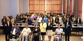 A group photo featuring participants, organizers, and workshop facilitators.