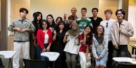 A group picture of an APCD representative, Ms. Thorfan Dechachainimit, with 15 students and Professor Kavin Cook in class on Civil Society Management.
