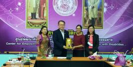 Mrs. Ubol Thongsalubluan, Provincial Social Development and Human Security Officer; Ms. Onanong Kumhang, Director of Center for Empowerment and Vocational Development for Persons with Disabilities in Nakhon Si Thammarat Province; and Mrs. Sarudda Promma, Head of Nakhon Sri Thammarat Shelter for Children, and their families presented Mr. Piroon Laismit, APCD Executive Director, with a token of appreciation.