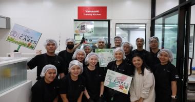 Participants pose for a photo after the bread making session.